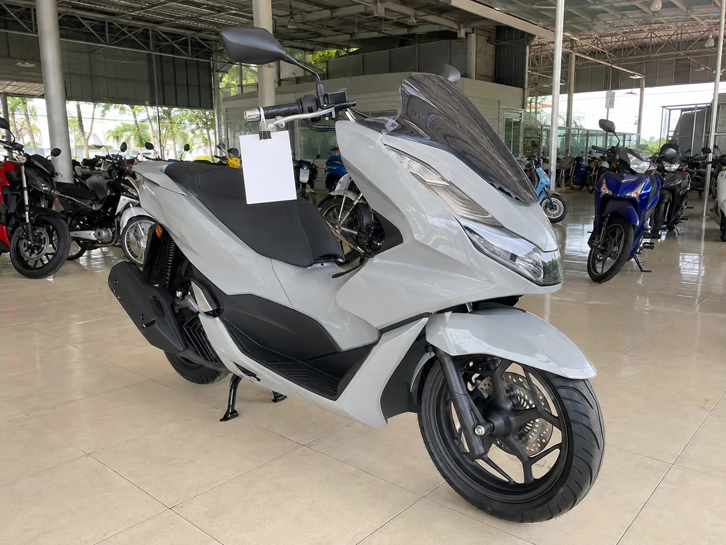 Honda PCX160 (ABS) on the showroom floor at Rungrueang Motor Roi Et